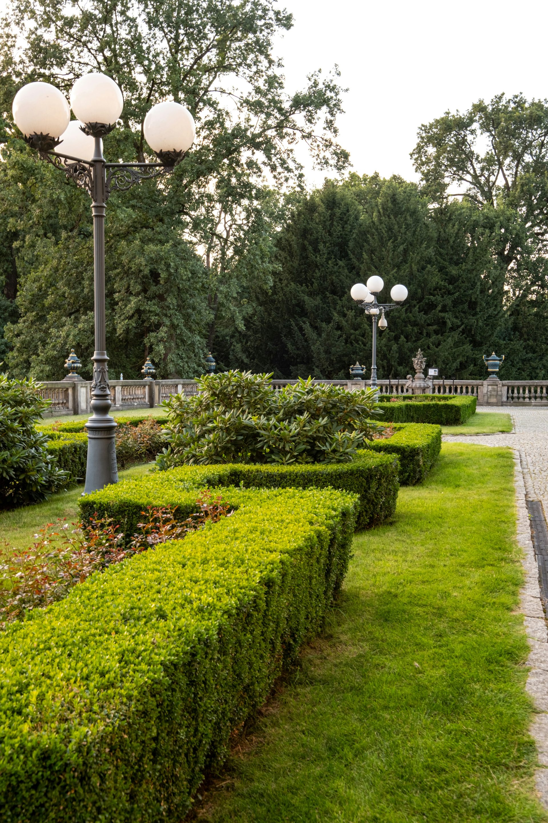 a garden with a lamp post